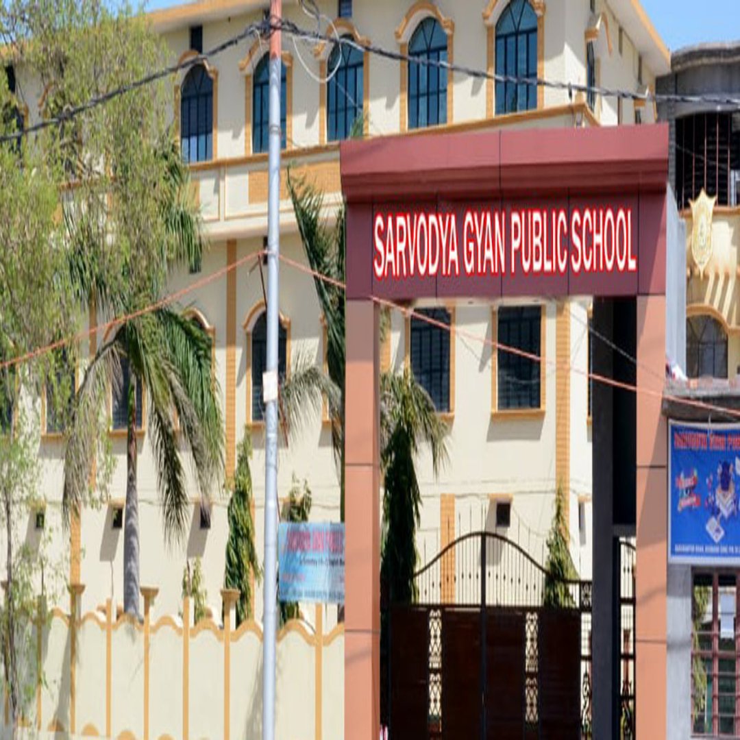 Modern school building with spacious campus, green lawns, playground, colorful classrooms bustling with students in daytime light surrounded by beautiful gardens and clear skies